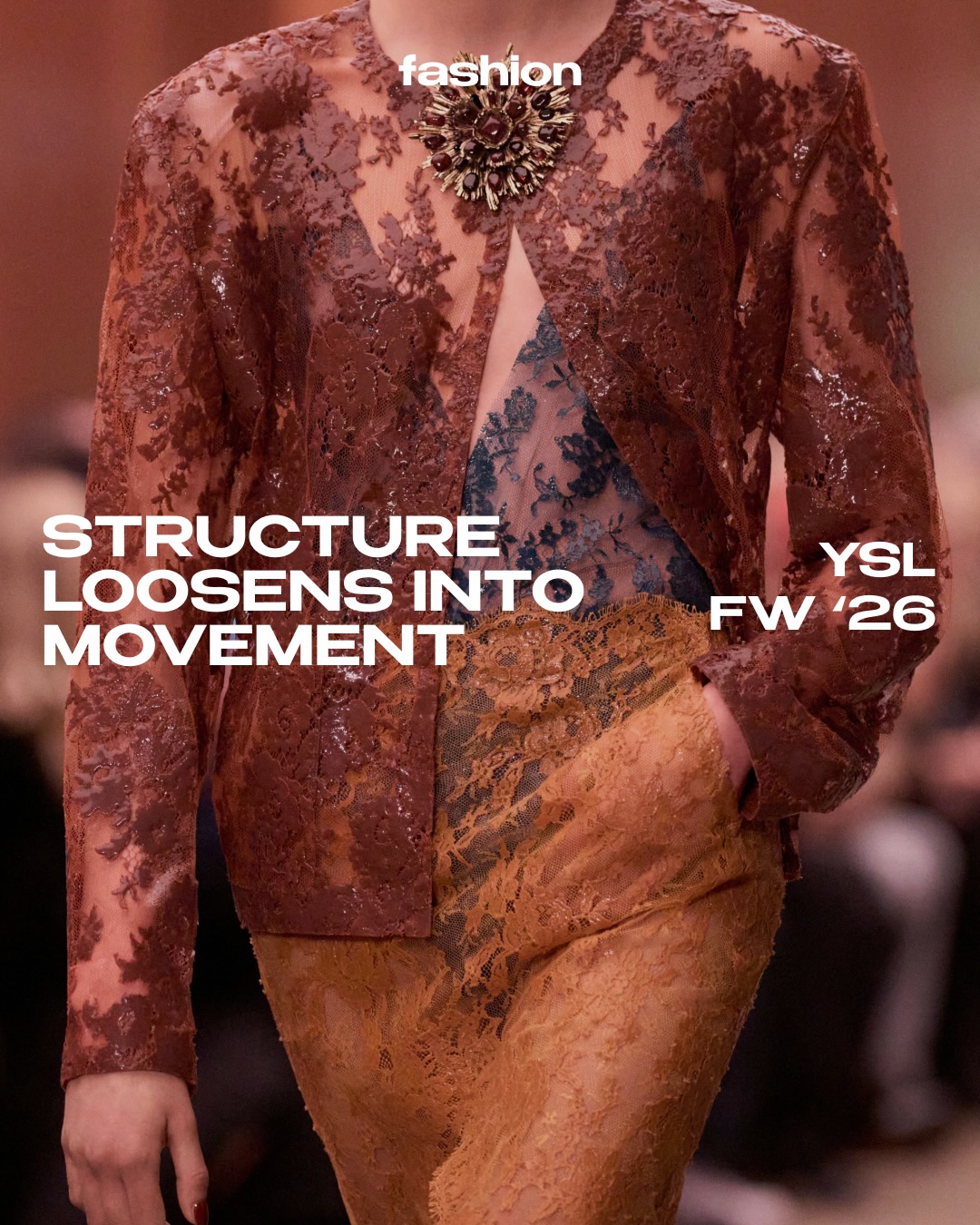Structure loosens into movement at the latest @ysl FW26 runway show.

Anthony Vaccarello revisits the house&rsquo;s founding codes through a lens of sensual restraint, where precision does not confine the body but allows it to flow with deliberate ease. The collection moves between control and release, tailoring and tactility, severity and seduction.

Sharp-shouldered suits glide with elongated silhouettes, their rigor softened by fluid fabrics and a languid attitude. Glossy trench coats, liquid satin dresses and sheer lace layers dissolve the boundary between masculine structure and intimate dressing. The palette remains deeply nocturnal, grounded in tobacco, espresso and burnt amber tones that echo the warmth of dim city lights.

Accessories amplify the narrative of tension and allure. Sculptural gold cuffs, oversized gemstone necklaces and razor-sharp heels evoke a sense of cinematic power, recalling the intellectual eroticism that defined Yves Saint Laurent&rsquo;s most radical years.

There is a literary undercurrent throughout, where clothing becomes character. Strength is never rigid, sensuality never obvious. Instead, each look suggests a quiet authority shaped by gesture, posture and presence.

With FW26, Saint Laurent reaffirms its singular language at Paris Fashion Week: disciplined yet instinctive, austere yet deeply sensual. A study in how structure, when loosened, becomes movement.